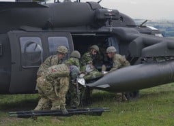 Photo By Sgt. Justin Geiger | U.S. and Romanian Soldiers transfer the simulated casualty to a UH-60 Black Hawk to air lift the Soldier to a local medical treatment facility in Romania at the Joint National Training Center in Cincu, July 8, 2017. Getica Saber 17 is a U.S-led fire coordination exercise and combined arms live fire exercise that incorporates six Allied and partner nations with more than 4,000 Soldiers. Getica Saber runs concurrent with Saber Guardian, a U.S. Army Europe-led, multinational exercise that spans across Bulgaria, Hungary and Romania with more than 25,000 service members from 22 Allied and partner nations. (U.S. Army photo by Sgt. Justin Geiger)