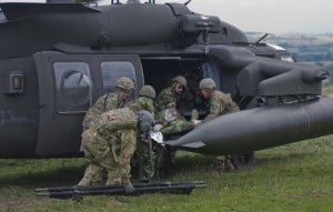 Photo By Sgt. Justin Geiger | U.S. and Romanian Soldiers transfer the simulated casualty to a UH-60 Black Hawk to air lift the Soldier to a local medical treatment facility in Romania at the Joint National Training Center in Cincu, July 8, 2017. Getica Saber 17 is a U.S-led fire coordination exercise and combined arms live fire exercise that incorporates six Allied and partner nations with more than 4,000 Soldiers. Getica Saber runs concurrent with Saber Guardian, a U.S. Army Europe-led, multinational exercise that spans across Bulgaria, Hungary and Romania with more than 25,000 service members from 22 Allied and partner nations. (U.S. Army photo by Sgt. Justin Geiger)